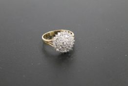 A HALLMARKED 9 CARAT GOLD DIAMOND CLUSTER RING, set with an estimated half carat of diamonds, approx