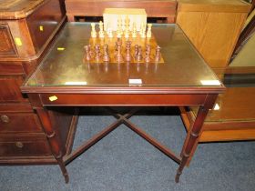 A REVERSIBLE CHESS TABLE ON STAND WITH PIECES