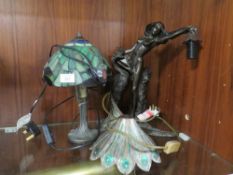 A BRONZE EFFECT TABLE LAMP OF A SEMI-NUDE WITH A PEACOCK, TOGETHER WITH A TIFFANY STYLE TABLE LAMP