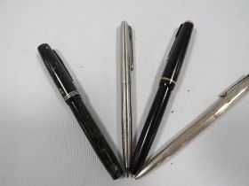 A GOLD NIB PARKER FOUNTAIN PEN TOGETHER WITH A STERLING SILVER PEN & TWO OTHERS