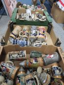 A LARGE COLLECTION OF ASSORTED BEER STEINS, TOBY AND CHARACTER JUGS OVER FOUR TRAYS