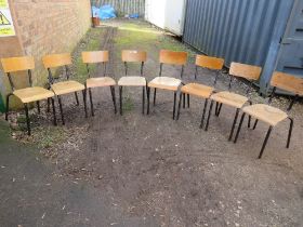 A SELECTION OF EIGHT STACKING INDUSTRIAL STYLE METAL AND WOOD CHAIRS