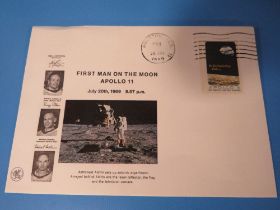 A STAMP CELEBRATING THE FIRST MAN ON THE MOON DATED 20th JULY 1969 ON AN ENVELOPE STAMPED HOUSTON