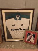 A FRAMED WOLVERHAMPTON WANDERERS SIGNED FOOTBALL CLUB SHIRT WITH A SIGNED SYLVESTER McCOY PHOTOGRAPH