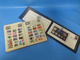 A SMALL STAMP COLLECTION IN A GLOBE TROTTER ALBUM TOGETHER WITH COINAGE OF THE COOK ISLANDS PROOF