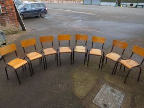 A SELECTION OF EIGHT STACKING INDUSTRIAL STYLE METAL AND WOOD CHAIRS