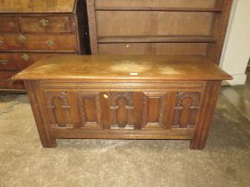 A SMALL OAK CARVED COFFER W-114 CM