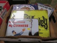 A BOX OF METAL SIGNS