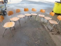 A SELECTION OF EIGHT STACKING INDUSTRIAL STYLE METAL AND WOOD CHAIRS