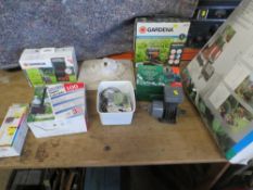 A SELECTION OF BOXED GARDENING ITEMS AND POOL PUMPS