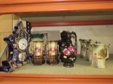 AN ORNATE CERAMIC CLOCK TOGETHER WITH A COLLECTION OF VINTAGE JUGS AND VASES