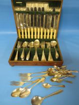 AN OAK CASED CANTEEN OF CUTLERY AND CONTENTS