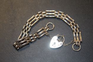 A HALLMARKED SILVER GATE BRACELET