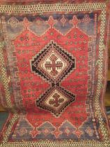 A LARGE RED WOOLLEN RUG TOGETHER WITH A SMALLER BLUE RUG AND A CHINESE RUG (3)
