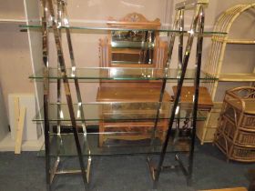 A MODERN GLASS AND CHROME FOUR SHELF OPEN BOOKCASE