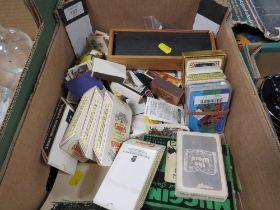 A SMALL TRAY OF COLLECTABLE PLAYING CARDS , MATCHBOXES ETC