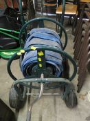 AN INDUSTRIAL WATER HOSE AND TROLLEY