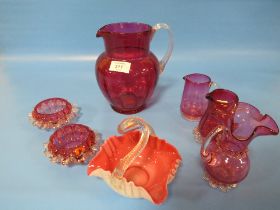 A SELECTION OF CRANBERRY STYLE GLASS WARE
