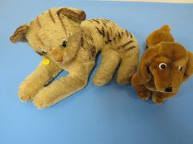 A STEIFF DACHSHUND TOGETHER WITH A STEIFF BABY TIGER (NO LABELS BUT BUTTONS IN EARS )