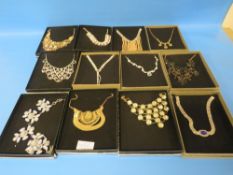 A SELECTION OF TWELVE ASSORTED BOXED NECKLACES