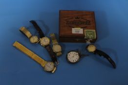 A DON THOMAS ROTHSCHILDS CIGAR BOX CONTAINING A SELECTION OF WRIST AND POCKET WATCHES TO INCLUDE A