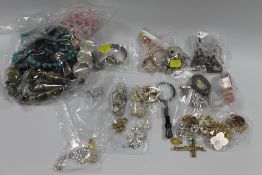 A TUB OF WATCHES AND COSTUME JEWELLERY