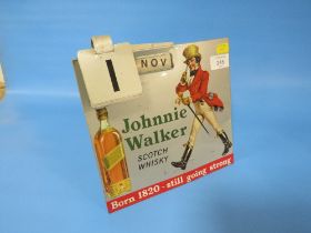 A VINTAGE METAL ADVERTISING SIGN AND DESK CALENDAR FOR JOHNNIE WALKER SCOTCH WHISKY