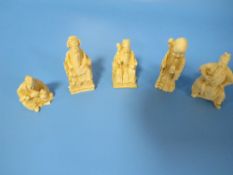 FIVE CHINESE TYPE SMALL CARVED BONE FIGURES
