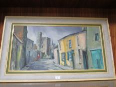 A MID CENTURY FRAMED OIL ON CANVAS OF A STREET SCENE WITH CASTLE BEYOND, SIGNED LOWER RIGHT ANNE