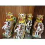 FIVE REPRODUCTION NOVELTY JUGS IN THE FORM OF A CAGE BEAR HOLDING A FELINE