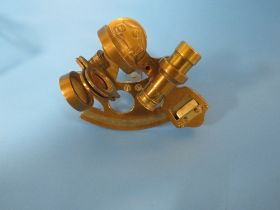 A SMALL BRASS SEXTANT