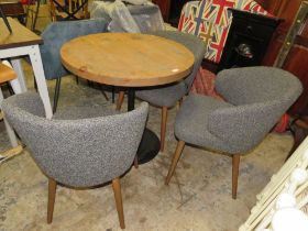 A MODERN BISTRO TABLE WITH THREE UPHOLSTERED CHAIRS