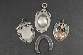 THREE HALLMARKED SILVER FOB MEDALS TOGETHER A BASS METAL MODEL OF A HORSESHOE (4)