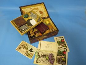 A VICTORIAN WORKBOX CONTAINING COLLECTABLE'S TO INCLUDE A SPALDING WHISTLE