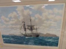 A GILT FRAMED AND GLAZED SIGNED PRINT OF HMS BEAGLE IN THE GALAPAGOS - JOHN CHANCELLOR