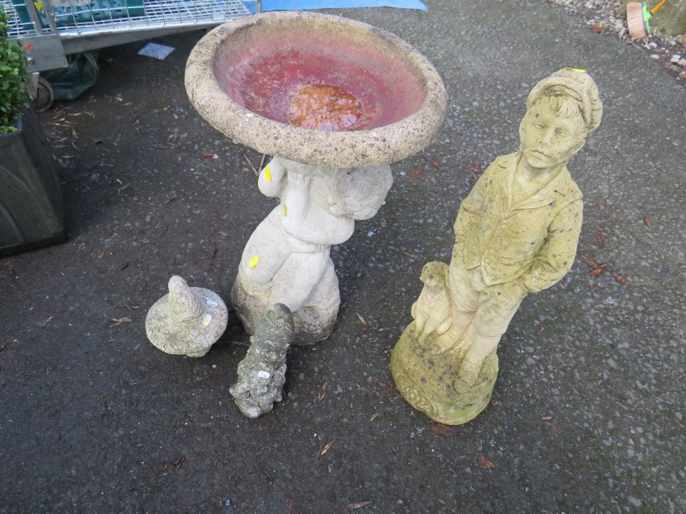 A CONCRETE BIRD BATH AND THREE STATUES