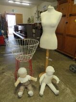A DRESSMAKERS DUMMY AND A BASKET OF TWO BABIES DUMMIES