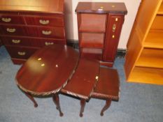 A REPRODUCTION MAHOGANY CABINET AND NEST OF TABLES