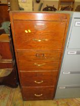 A VINTAGE WOODEN 4 DRAWER FILING CABINET