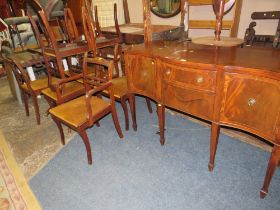 A REPRODUCTION MAHOGANY SHAPED SIDEBOARD WITH A TWIN PEDESTAL TABLE AND EIGHT CHAIRS