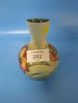 A SMALL MOORCROFT VASE WITH FLORAL DECORATION