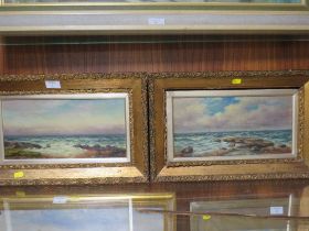 A PAIR OF GILT FRAMED ROCKY SEASCAPES, BOTH SIGNED LOWER RIGHT BY T.P. FALLAW, 16.5 X 34.5 CM A/F