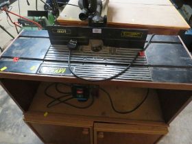 A POWER CRAFT ROUTER WITH TABLE AND WORK STATIONS WITH ACCESSORIES