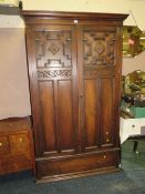 AN EARLY 20TH CENTURY OAK WARDROBE WITH DRAWER