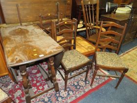 AN OAK DROPLEAF TABLE AND FOUR CHAIRS