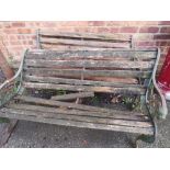 TWO WOODEN AND CAST IRON GARDEN BENCHES