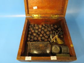 AN OLD WOODEN BOX CONTAINING ROSEMARY BEADS