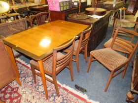 A MID-CENTURY EXTENDING GIMSON & SLATER LTD VESPER DINING TABLE & FOUR CHAIRS