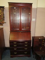 A REPRODUCTION MAHOGANY BUREAU BOOKCASE