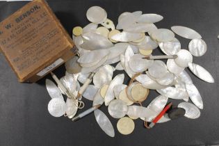 A COLLECTION OF MOSTLY MOTHER OF PEARL COUNTERS INCLUDING FISH SHAPED EXAMPLES